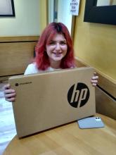 Poppy receiving her laptop